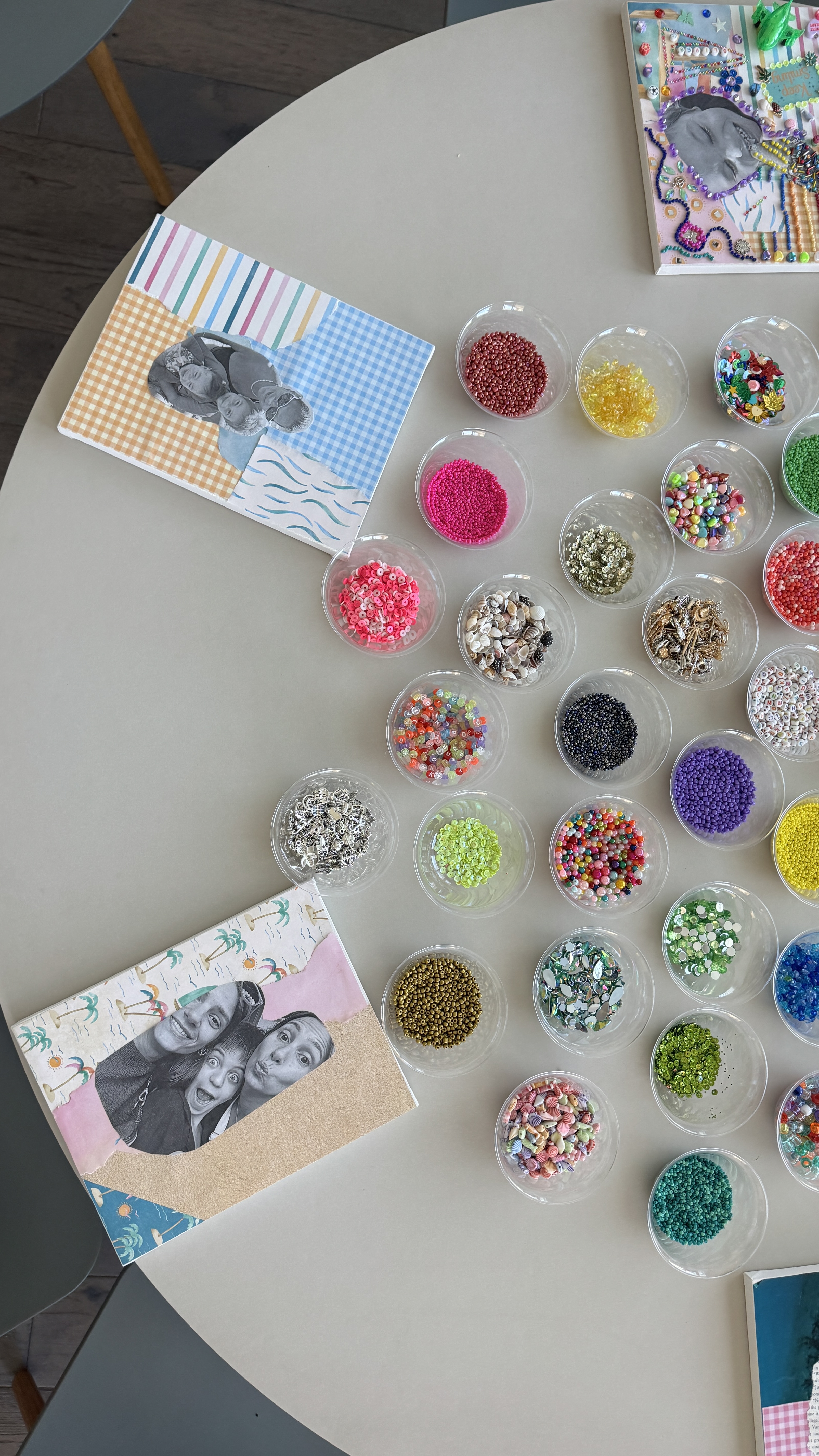 Make Space event setup with canvases and colorful bead containers on a table